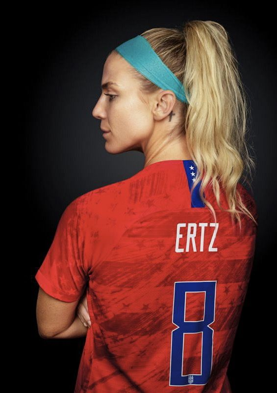 Julie Ertz Cross Tattoo Behind Ear